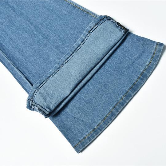 High waist slim jeans with button placket